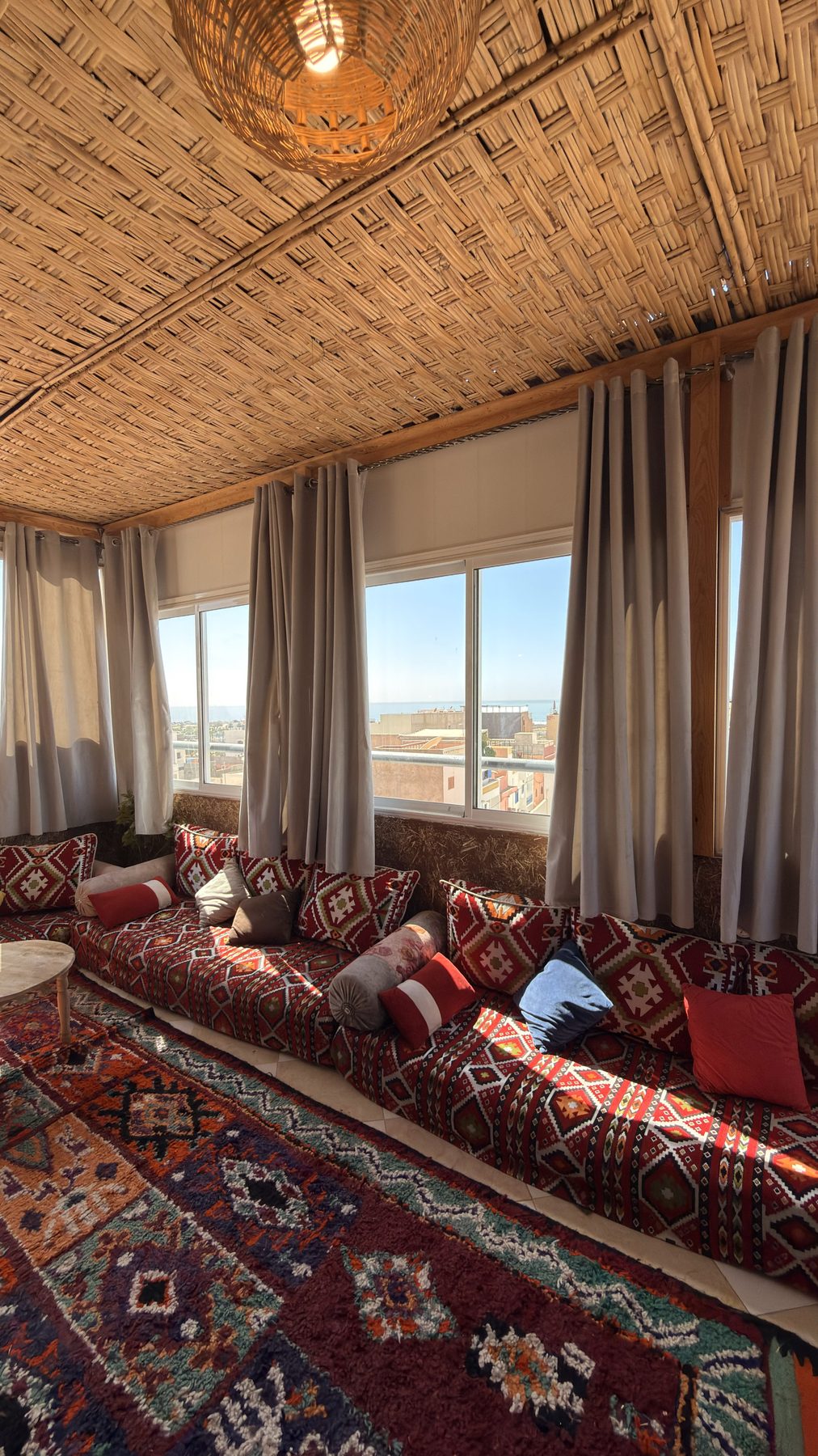Berber lounge on the top floor of the riad, with low seating and rugs